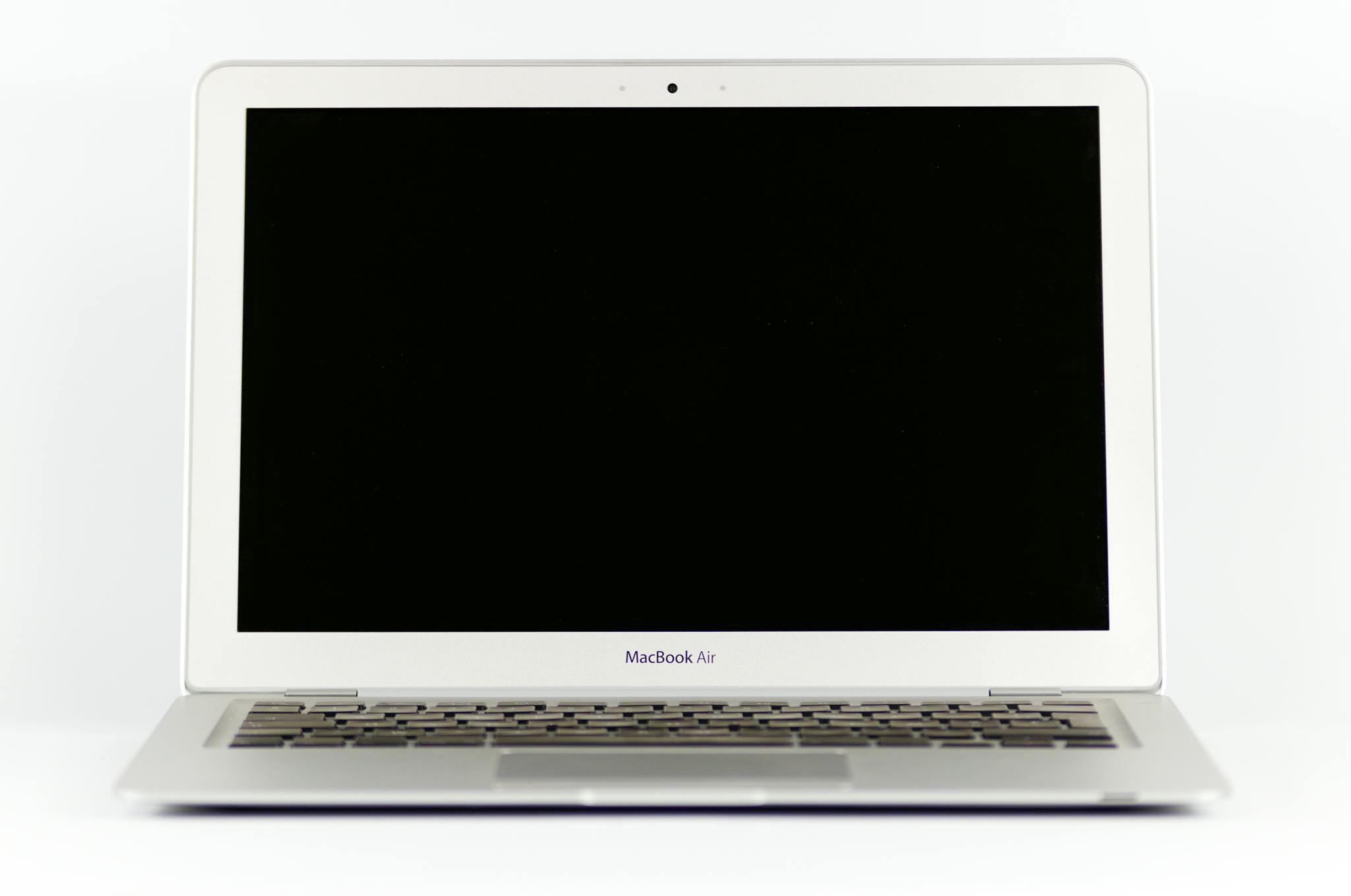 Front view of a MacBook Air laptop with a blank screen on a white background.